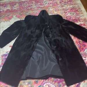 Sheared black brown mid length mink coat.